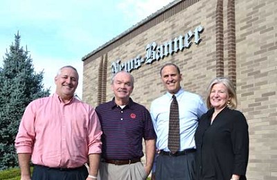 Doug Brown, left, will become the president and publisher of the News-Banner on Nov. 1 while Mark Miller, second from left, will become a contributing editor for the newspaper. They are shown with George and Diane Witwer, the primary owners of News-Banner Publications. (Photo by Dave Schultz).